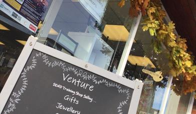 Shop exterior with autumn leaves outside