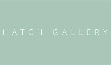 Hatch Gallery white text on green logo book-ended by martini glasses.