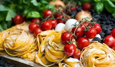 Italian food: vine tomatoes, fresh pasta, mozzarella and basil.