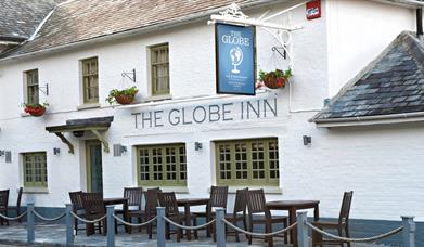 globe inn pub exterior painted white.