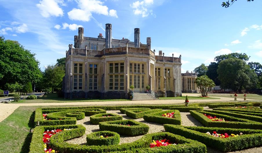 Castle on sunny day with Parterre hedge in the foreground