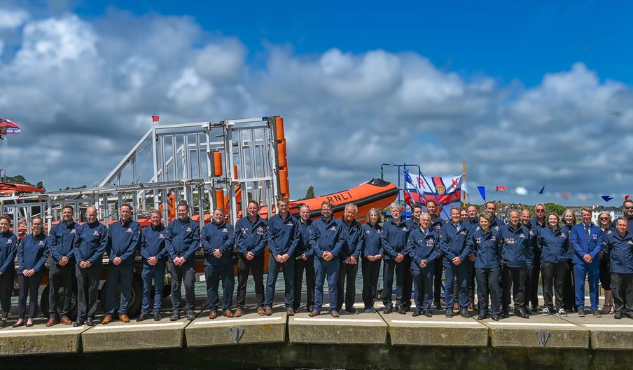 lifeboat station with staff lined up in front