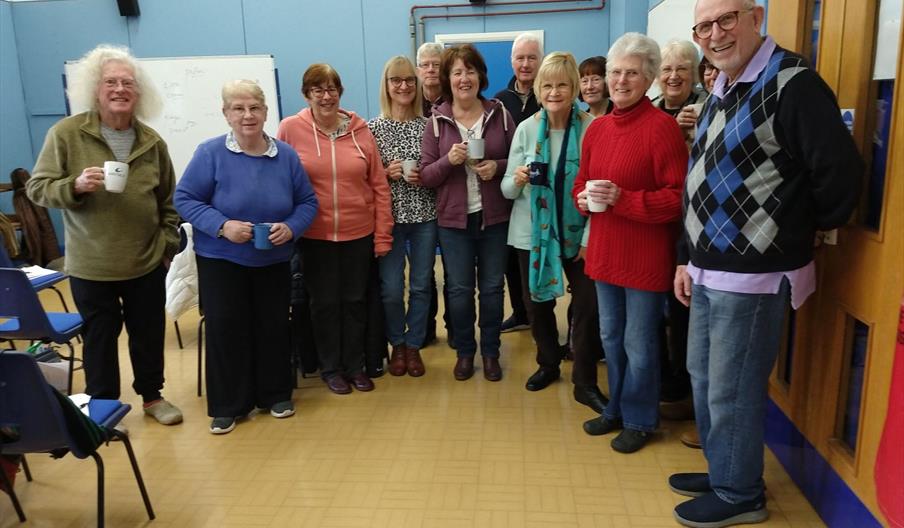 Older community members smiling at camera