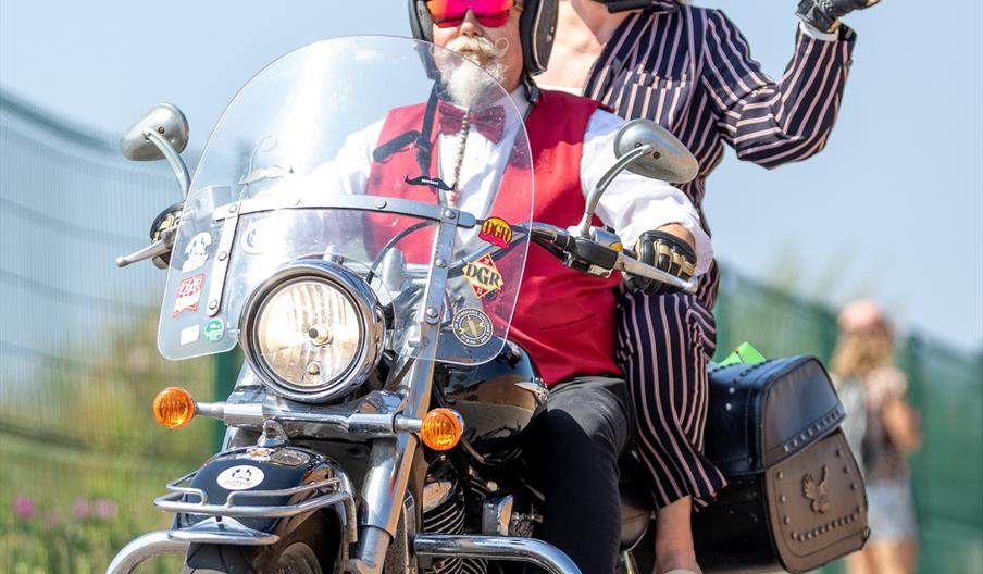 Man & woman on moped