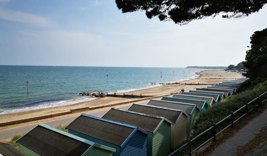 Friars Cliff Beach Huts view west towards Mudeford and Bournemouth.