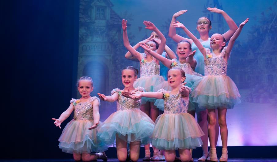 Children on stage performing