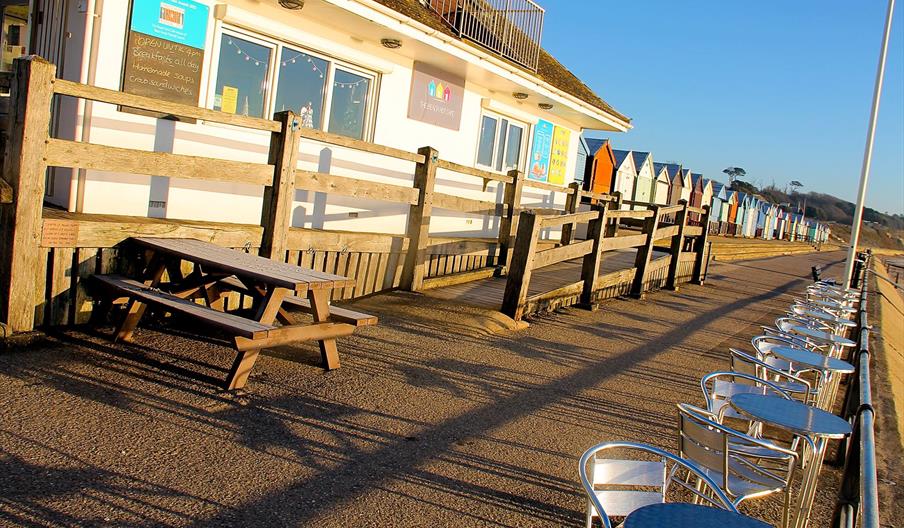 Beach hut cafe in the bright sunlight.