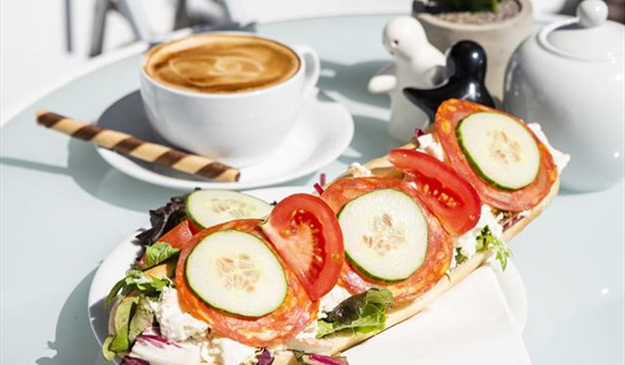 yummy looking coffee and open sandwich.