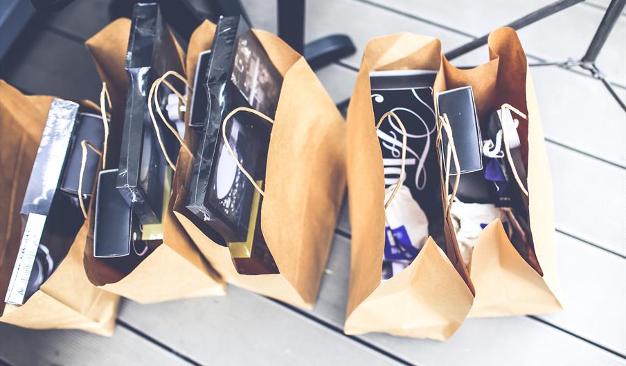 shopping bags full of clothes