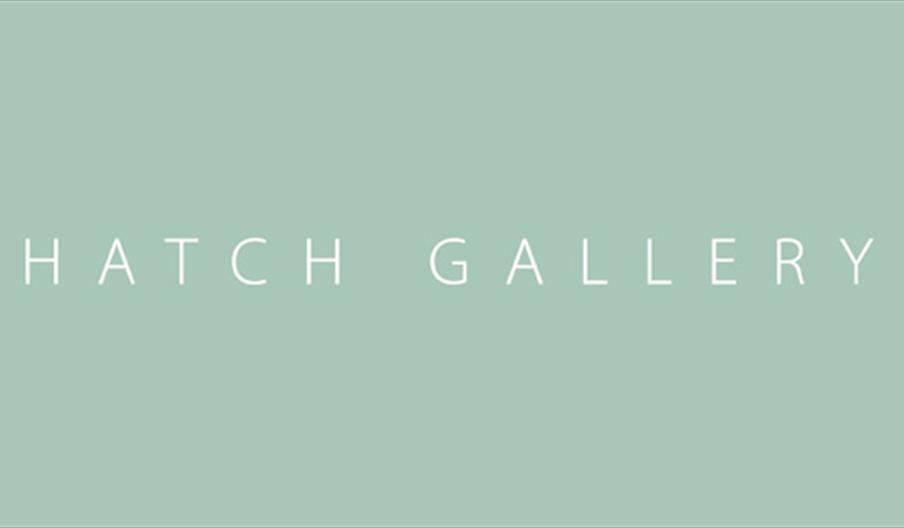 Hatch Gallery white text on green logo book-ended by martini glasses.