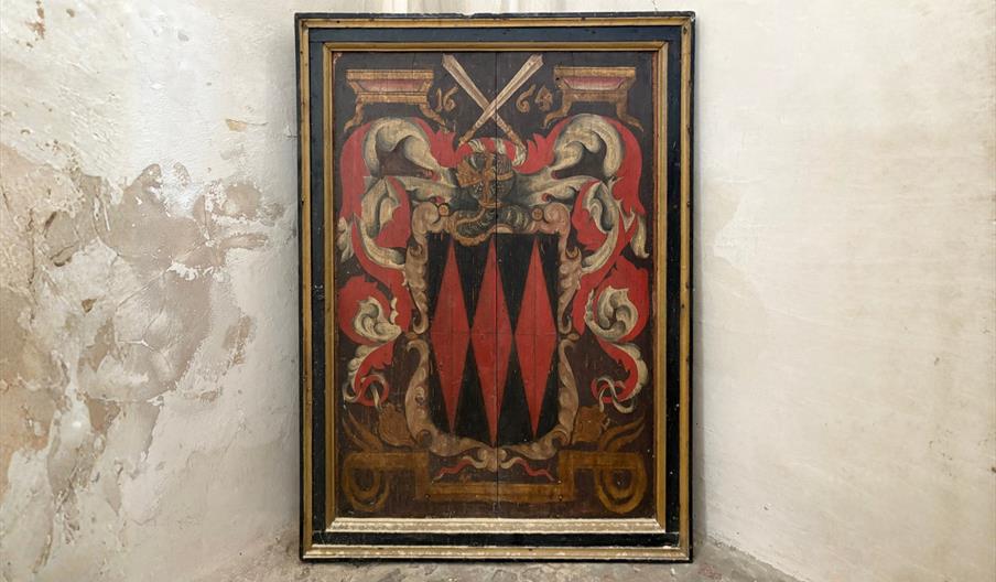 Heraldic panel displayed inside Christchurch Priory