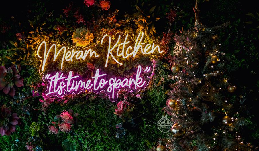 Neon Meram Kitchen sign saying "It's time to spark"