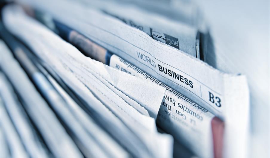 newspapers in a stack.