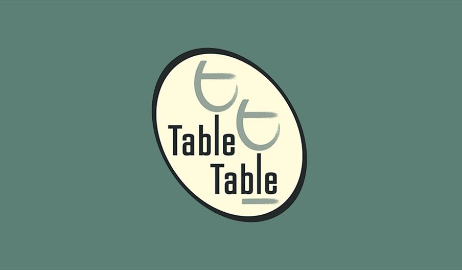 table table logo on green background.