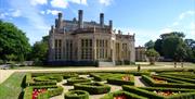 Castle on sunny day with Parterre hedge in the foreground
