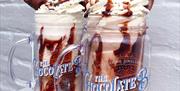 Two exciting looking kinder bueno and reece's pieces flavoured milkshakes