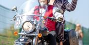 Man & woman on moped