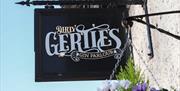 Dirty Gerties sign in black, white and gold