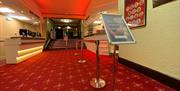 Inside the Regent Centre with red and gold carpet.