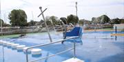Christchurch Splash Park showing a sunken paddling pool with handrail and stepping stones, an anchor fountain  feature and other water sprays and jets