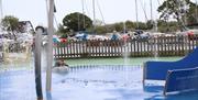 Christchurch Splash Park showing an anchor fountain water feature and other water sprays and jets with the Quay in the background