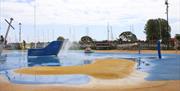 Christchurch Splash Park showing an anchor fountain water feature and bow of a play ship, plus other water sprays and jets with the Quay in the backgr