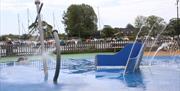 Christchurch Splash Park showing an anchor fountain water feature and other water sprays and jets with the Quay in the background