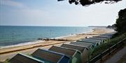 Friars Cliff Beach Huts view west towards Mudeford and Bournemouth.