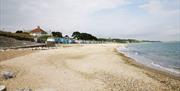 Wide shot of the sand and shingle beach.