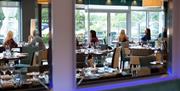 Restaurant interior with tables and diners