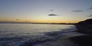 Highcliffe beach at dawn early morning sunrise.