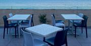 Terrace of restaurant overlooking beach