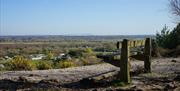 Park bench on top of the hill looking out over Dudmoor Farm and North Christchurch.