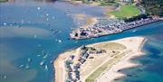 Mudeford spit shot from above, the harbour is full of activity