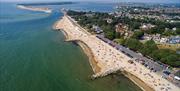 High shot looking down at Avon Beach, Mudeford Quay and Hengistbury Head in the distance.